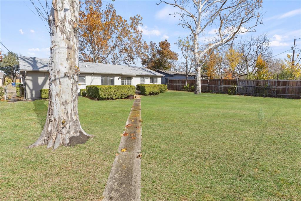 4110 Colgate Lane Garland, TX 75042 - Photo 5 of 22 a front view of a house with a yard and trees
