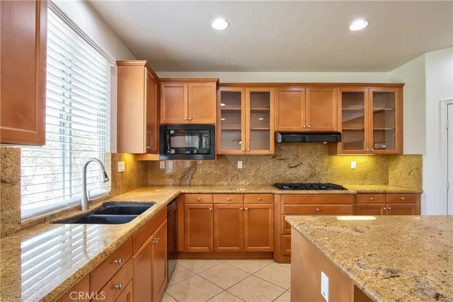 a view of empty room with a fireplace and wooden floor