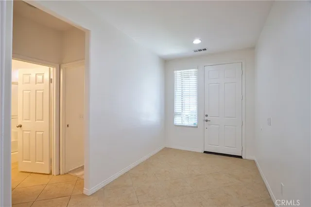 a bedroom with bed and window