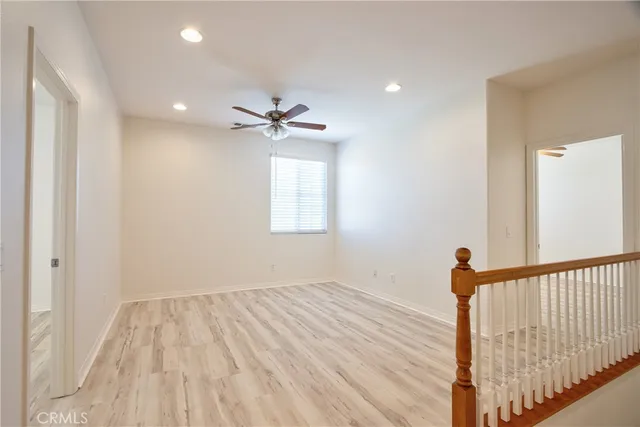 a bathroom with a granite countertop sink a bathtub a mirror a vanity a bathtub and a sink