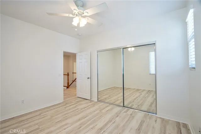 a view of a patio with a table and chairs and potted plants