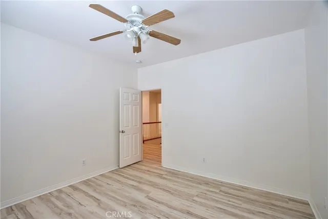an aerial view of a house with a yard and balcony