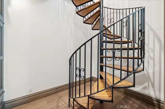 a living room with furniture a chandelier and a fireplace