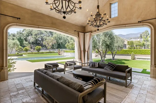 a spacious bedroom with a bed a couch and dresser