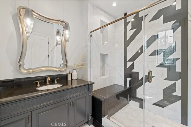 a spacious bedroom with a bed and a large window