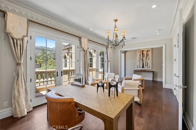 a bathroom with a granite countertop sink and a large mirror