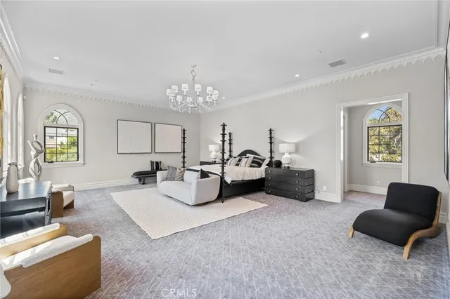 a view of a house with potted plants