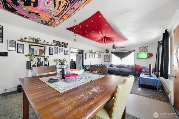 a living room with furniture and flat screen tv