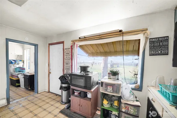 a room that has a bed and a table in it