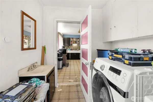 a bedroom with bed and a flat tv screen