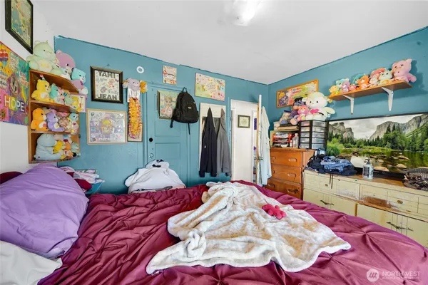 a living room with furniture and next to a window
