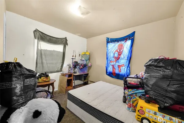 a bedroom with furniture and a closet