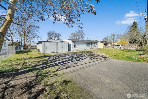 a view of a backyard of the house