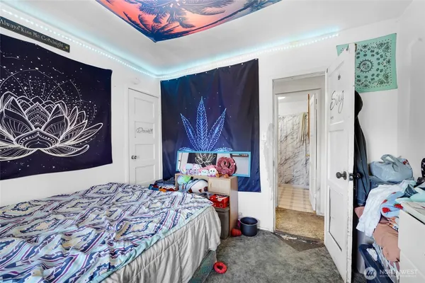 a bedroom with a bed and dresser