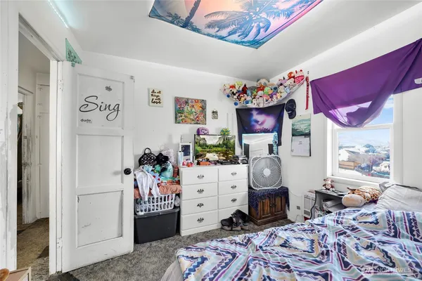 a bathroom with a toilet sink and shower
