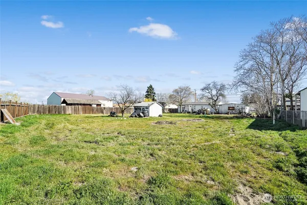a house view with swimming pool in front of it