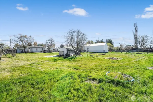a view of a swimming pool with a yard