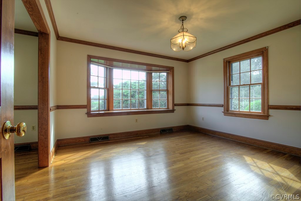 2853 New Market Road Richmond, VA 23231 - Photo 7 of 39 Living Room Opens to Formal Dining Room with Bay W