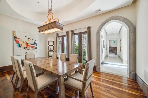 a living room with furniture a ceiling fan and a rug