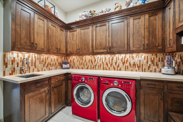 a spacious bedroom with a bed and a flat screen tv