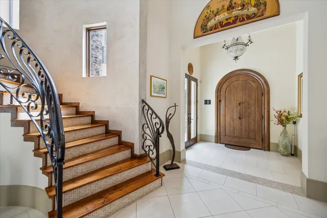 a living room with furniture and a floor to ceiling window