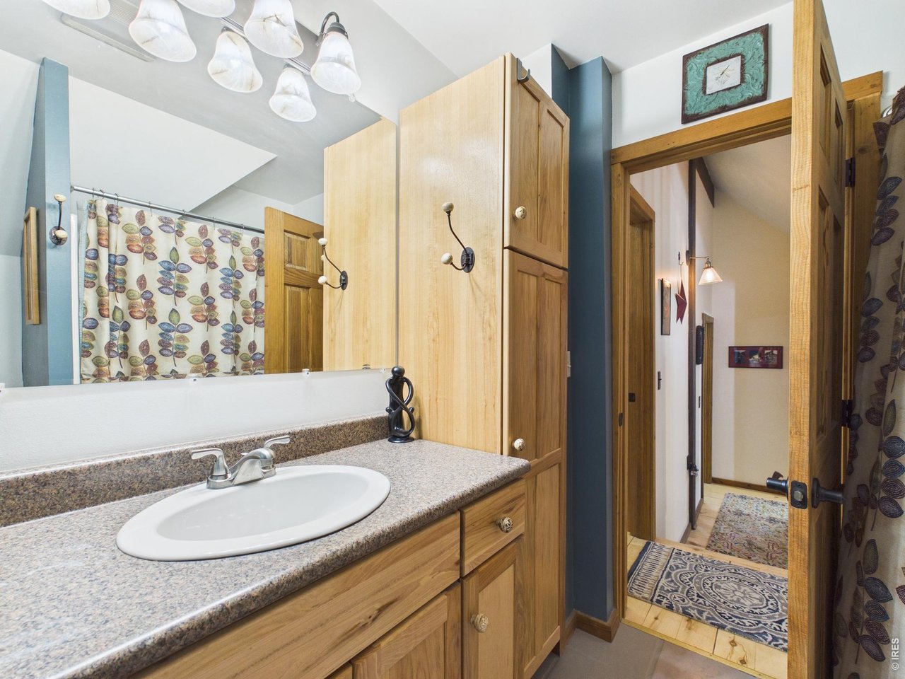 131 West Boulder Street Nederland, CO 80466 - Photo 26 of 46 Main bath, remodeled, roomy, efficient, custom cabinets, full bath.