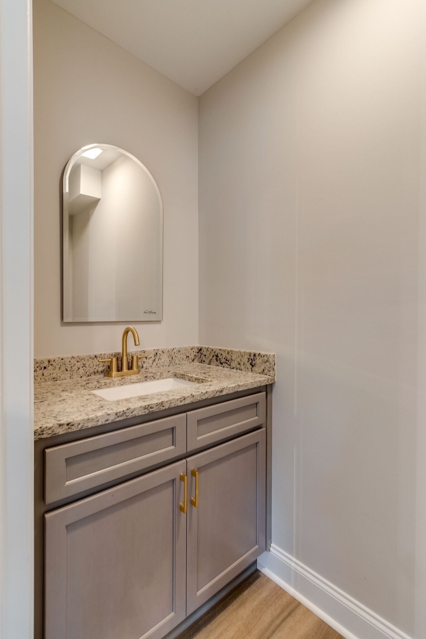 1008 Beckett Street, Unit A Columbia, TN 38401 - Photo 15 of 29 a bathroom with a granite countertop sink and a mirror