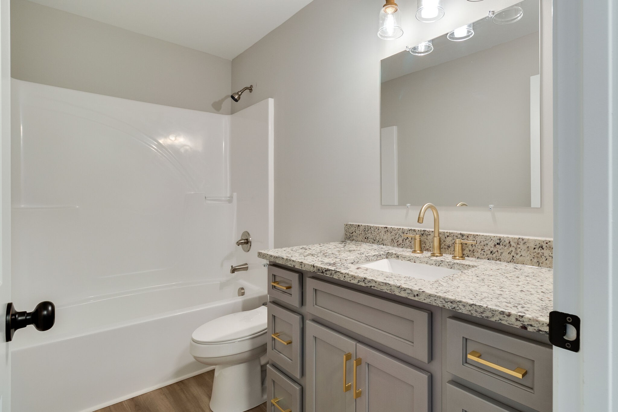 1008 Beckett Street, Unit A Columbia, TN 38401 - Photo 20 of 29 a bathroom with a granite countertop sink toilet and shower