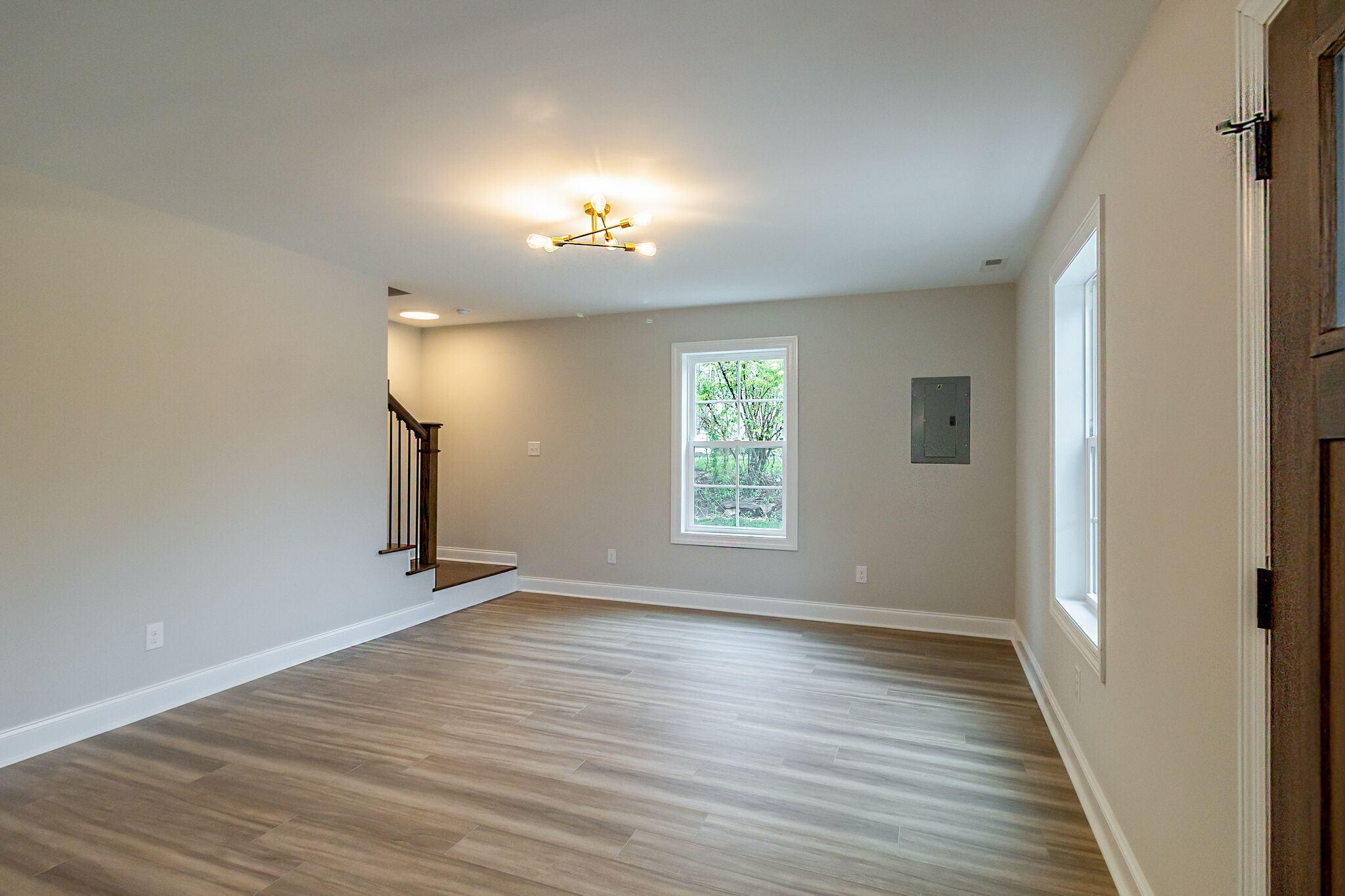 1008 Beckett Street, Unit A Columbia, TN 38401 - Photo 6 of 29 an empty room with wooden floor and windows
