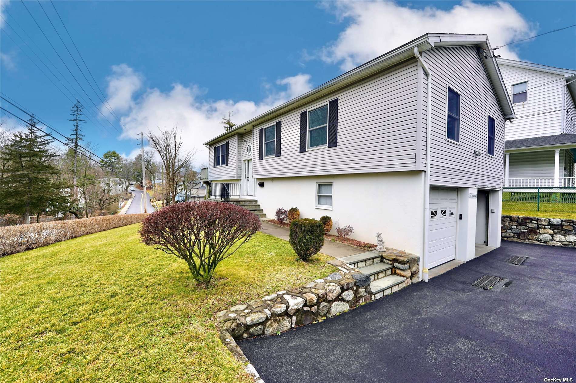 1 A Ryder Road Ossining, NY 10562 - Photo 1 of 1 a view of a white house with a yard and sitting area