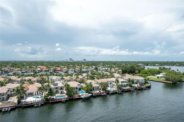 an aerial view of a city with lake view