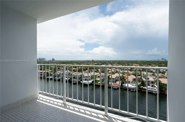 a view of a balcony next to a lake
