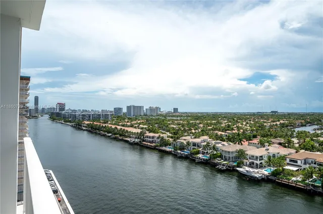 an aerial view of a city with lake view