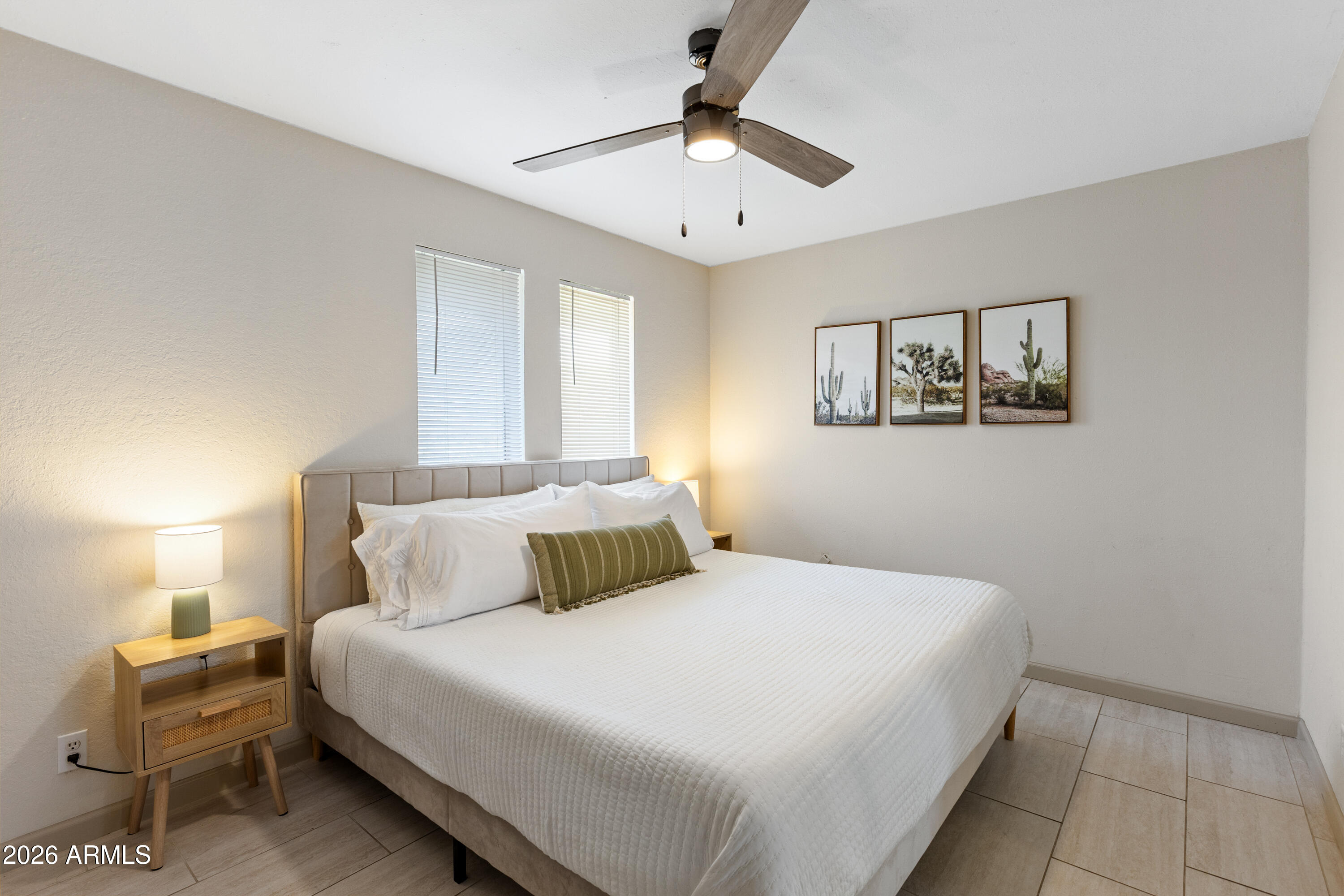 111 South Cholla Street Gilbert, AZ 85233 - Photo 26 of 34 a bedroom with a large bed and a chandelier