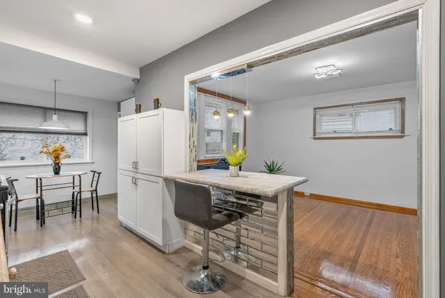 a work place with furniture and wooden floor