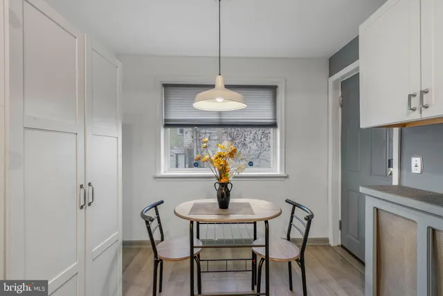 a dining room with furniture and window