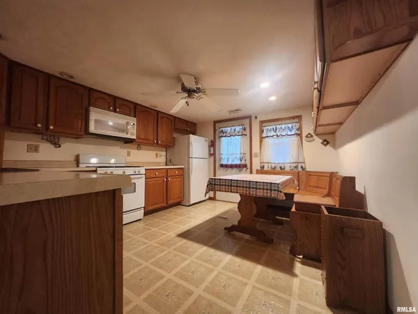 a kitchen with a sink cabinets and window