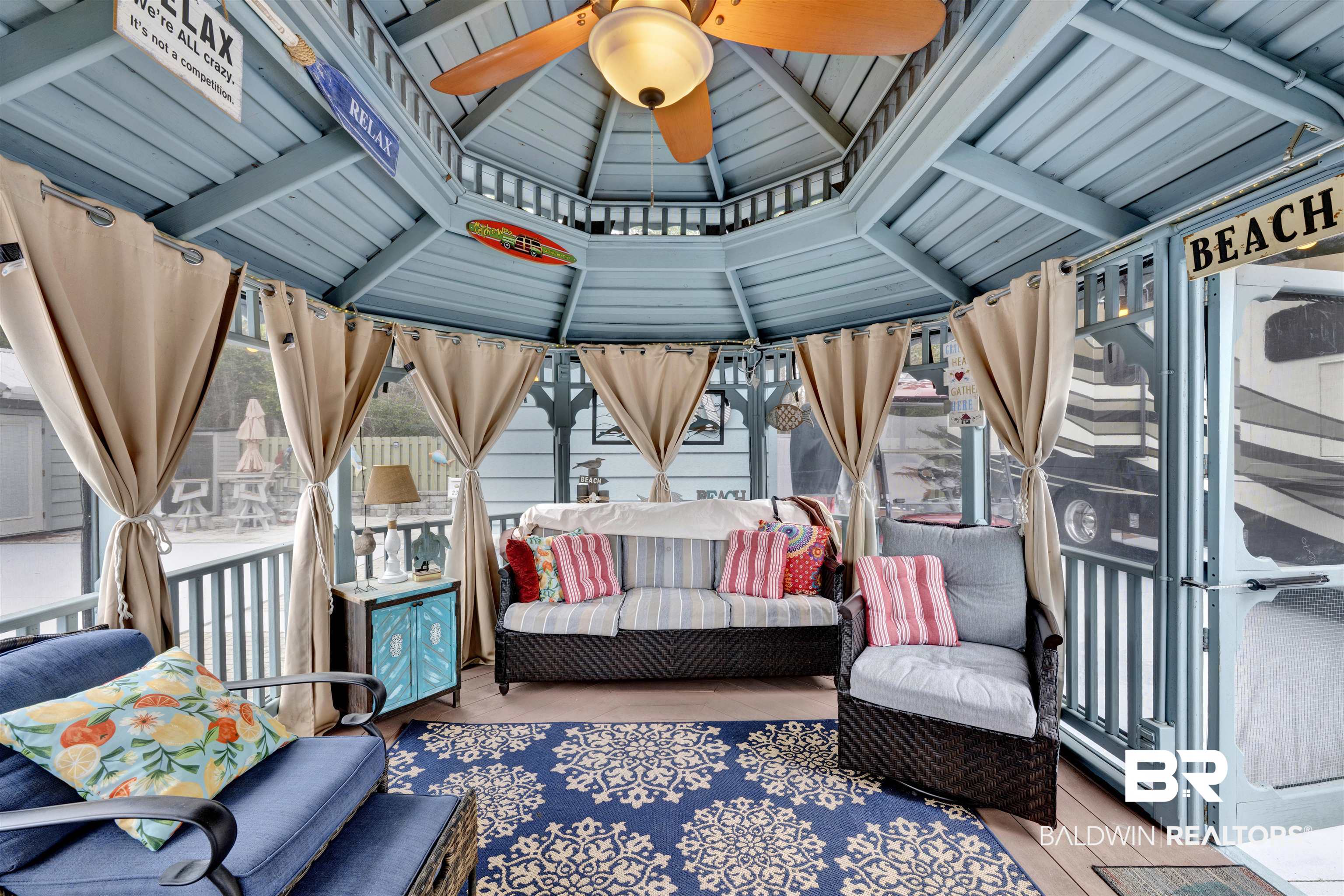 4650 Griffith Marina Road, Unit LOT 24 Orange Beach, AL 36561 - Photo 18 of 34 Sunroom with a ceiling fan, outdoor lounge area, and a gazebo