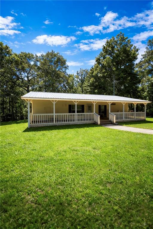 180 Alonzo Cain Road Dahlonega, GA 30533 - Photo 2 of 28 a front view of a house with a garden