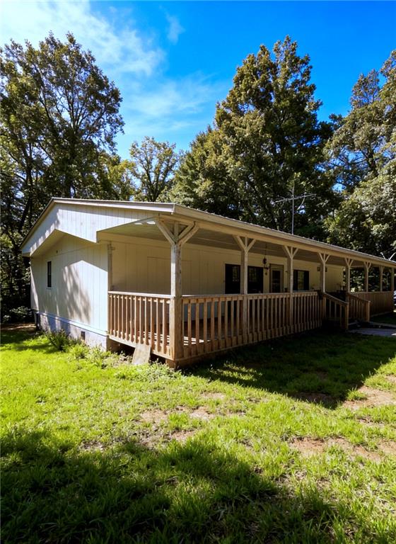 180 Alonzo Cain Road Dahlonega, GA 30533 - Photo 5 of 28 a view of a house with a yard