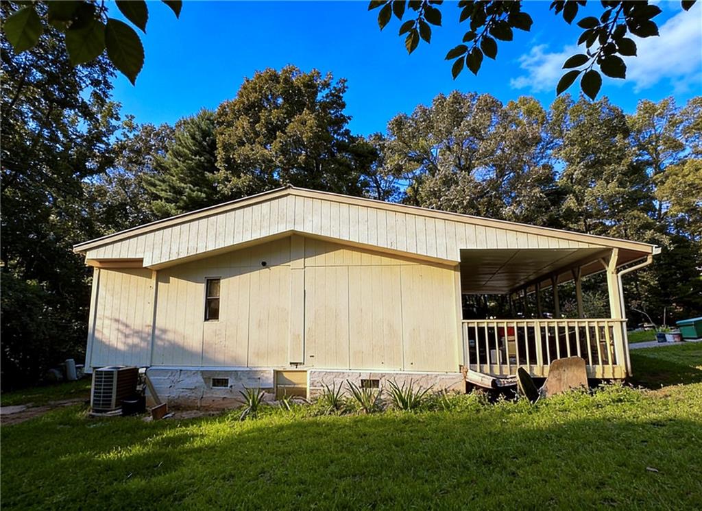 180 Alonzo Cain Road Dahlonega, GA 30533 - Photo 6 of 28 a front view of a house with garden