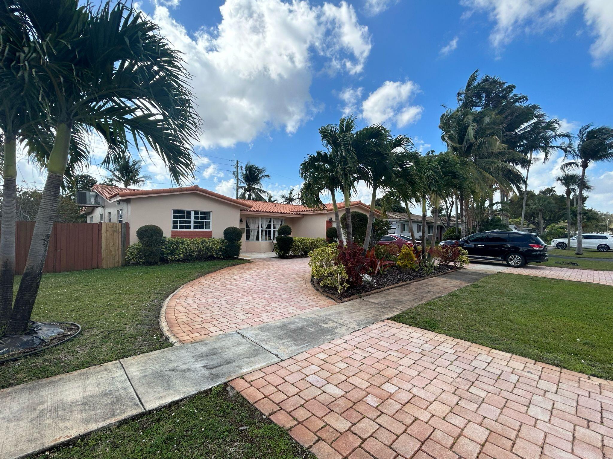 5200 Adams Street Hollywood, FL 33021 - Photo 1 of 24 a view of street with parked cars