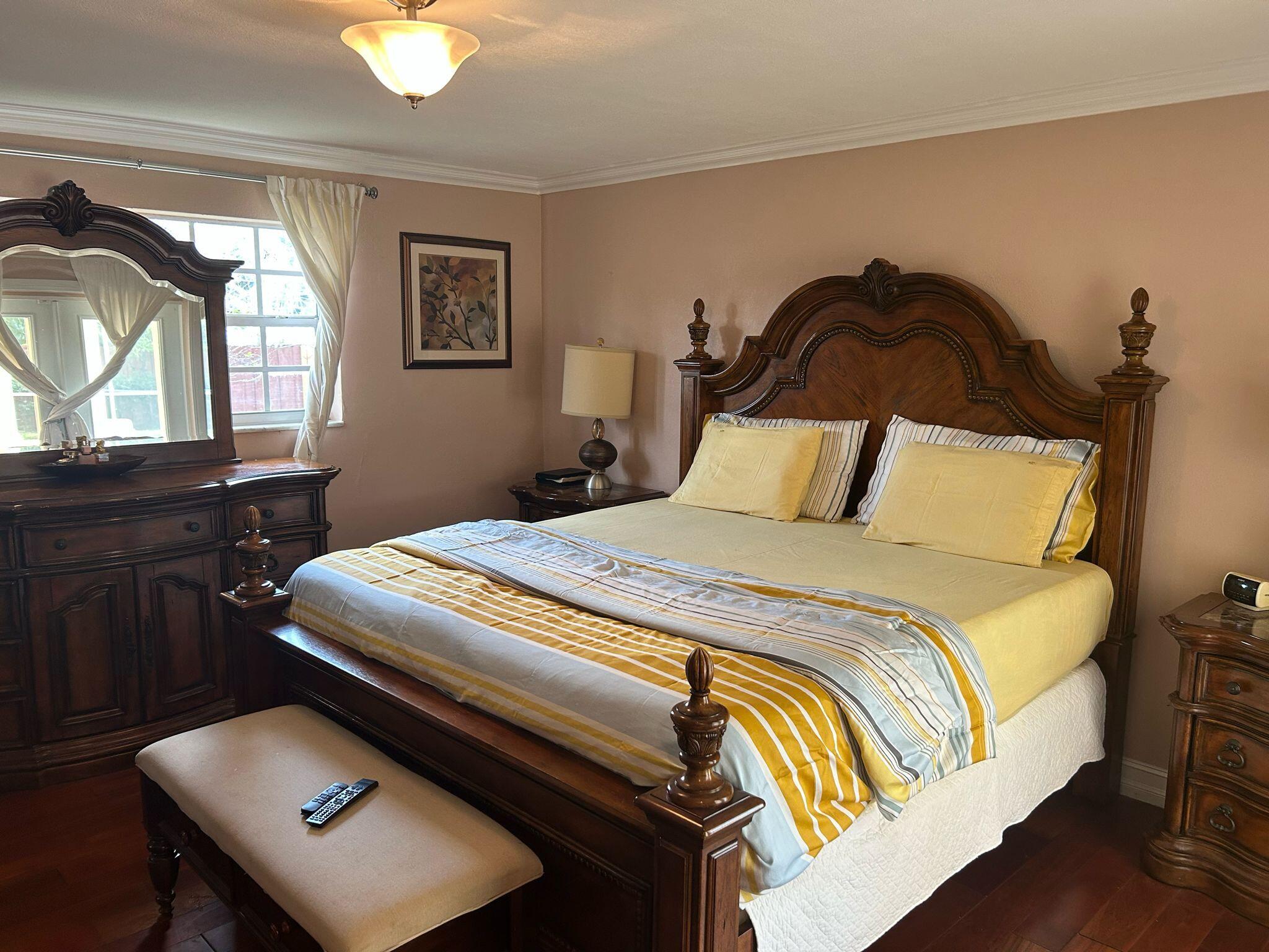 5200 Adams Street Hollywood, FL 33021 - Photo 14 of 24 a bedroom with a bed and window
