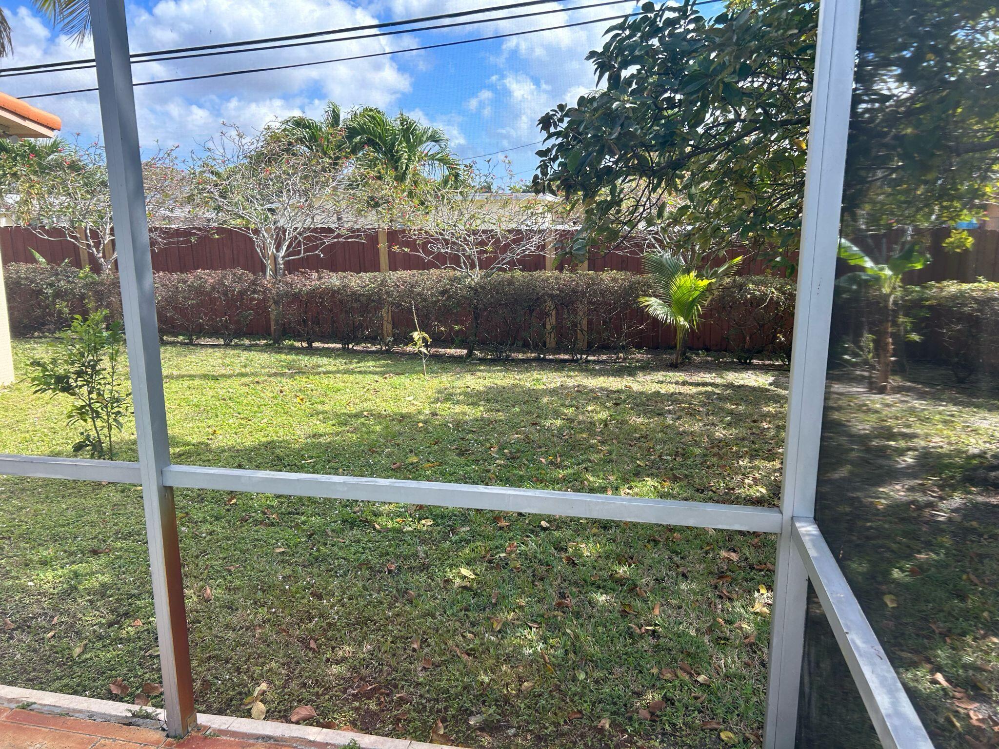5200 Adams Street Hollywood, FL 33021 - Photo 18 of 24 a view of a back yard from a balcony