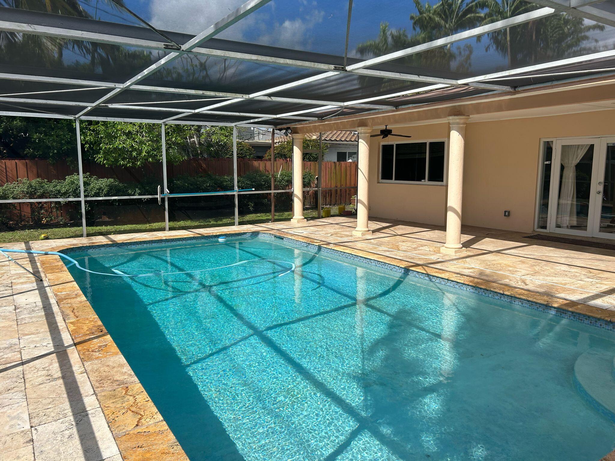 5200 Adams Street Hollywood, FL 33021 - Photo 19 of 24 a view of an empty room with windows
