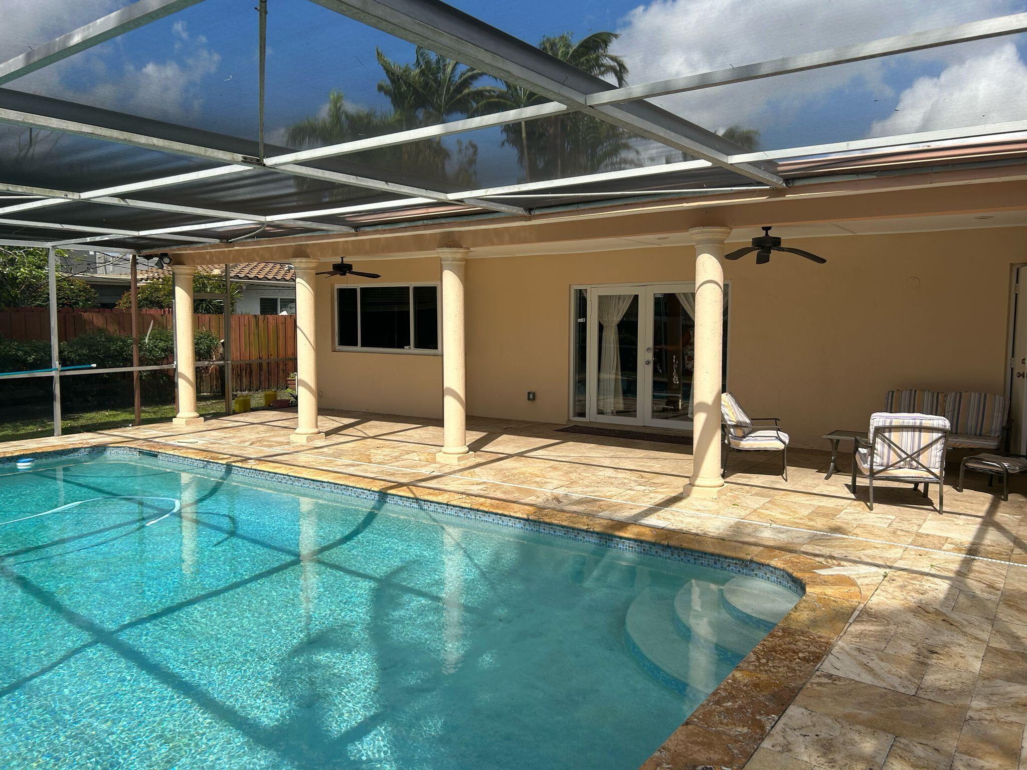 5200 Adams Street Hollywood, FL 33021 - Photo 20 of 24 a view of a house with swimming pool