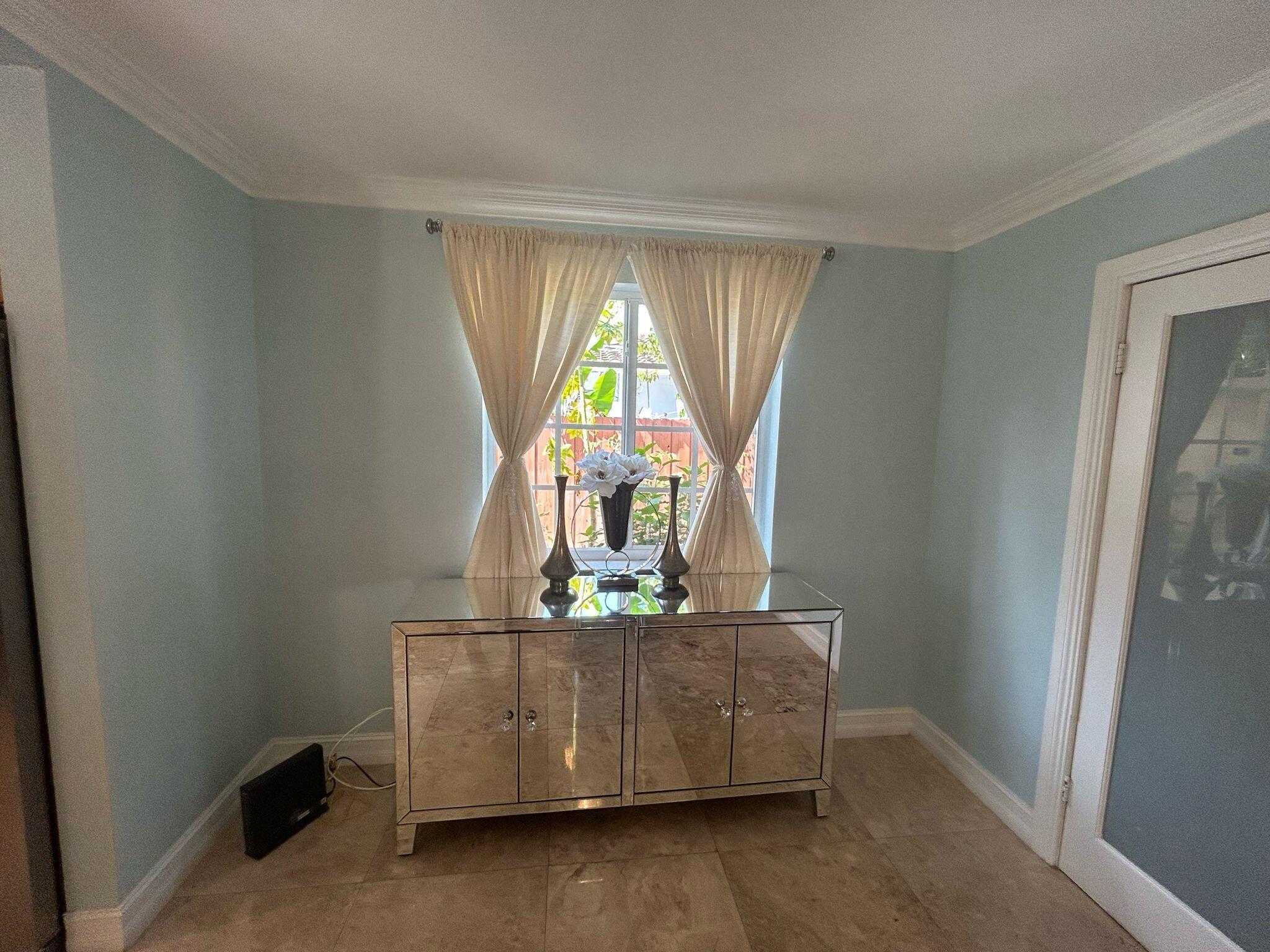 5200 Adams Street Hollywood, FL 33021 - Photo 4 of 24 a living room with furniture and a window