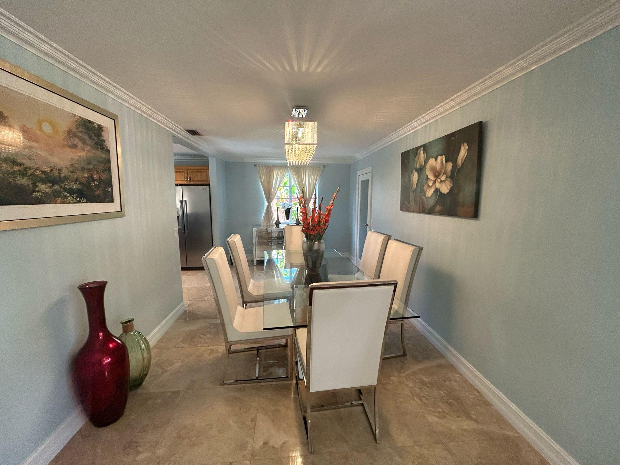 5200 Adams Street Hollywood, FL 33021 - Photo 6 of 24 a dining room with furniture and window
