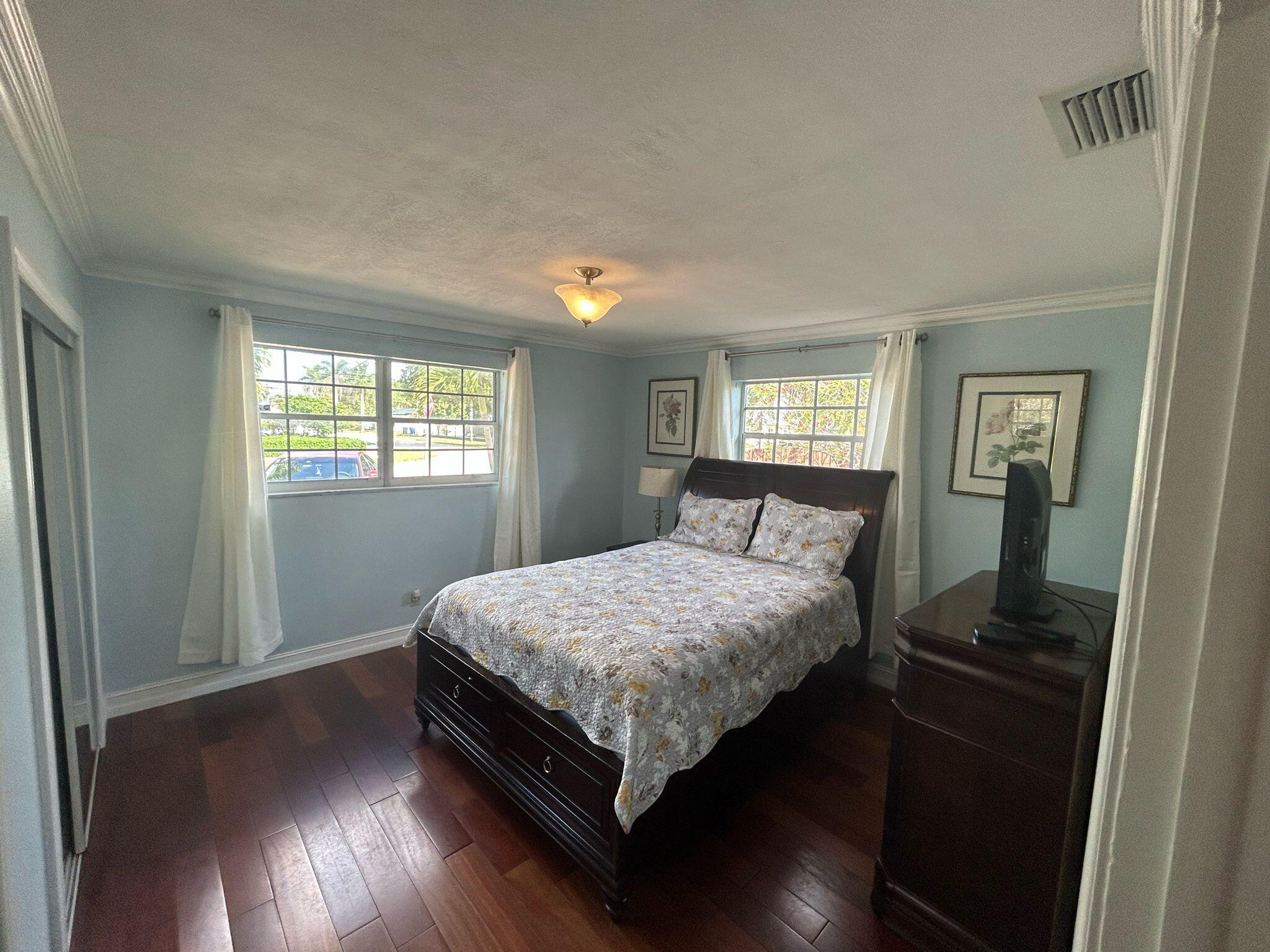 5200 Adams Street Hollywood, FL 33021 - Photo 8 of 24 a bedroom with a bed and window