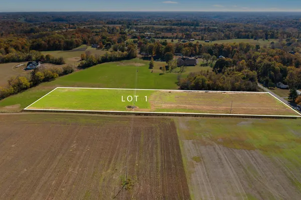 an aerial view of a houses with a outdoor space